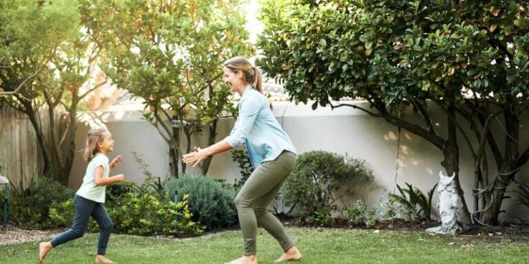 mom and daughter playing outdoors